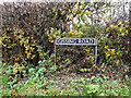 TM1685 : Gissing Road sign by Geographer