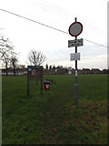 TM1179 : Notice Board & Roadsign on Fair Green by Geographer