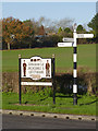 Village sign and fingerpost, Westwood