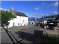 Ullapool - View SSE along Quay St towards Pier.