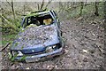 SP0025 : Abandoned car in Breakheart Plantation by Philip Halling