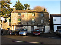 NY7146 : Old garage building, Townhead, Alston by Andrew Curtis
