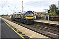 Colourful diesel locomotive heads south through Northallerton Station