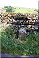 Old milestone near Woodhall