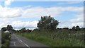 The Downpatrick Road running alongside the Ballygilbert Reservoir