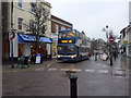 Bus turning from High Street into Turk Street