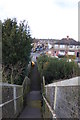 Looking west down steps from railway footbridge