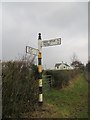 NY3155 : Signpost, Aikrigg by Richard Webb