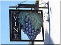 Sign for The Vine, High Street / New Road, SG12