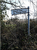 TM1377 : Roadsign on Church Lane by Geographer