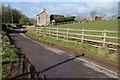 Country road passing Tir-uched Farm