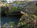 The downstream side of Bradford Bridge on the Little Dart River