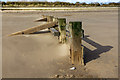 TF5764 : Groyne on the beach, Skegness by David P Howard