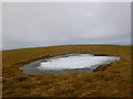 NX5998 : Partly frozen pool, Cairnsmore of Carsphairn by Alan O'Dowd