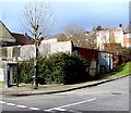 Grey phonebox, tree and electricity substation on a Caerau corner