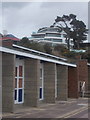 Sandbanks: beach huts and a posh house