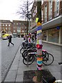 Cycle racks in Bedford Street, Exeter with yarnbombing