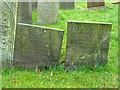 SK6929 : Hickling Churchyard - Belvoir Angel and other headstone by Alan Murray-Rust