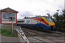 SK8316 : Train passing Whissendine signal box and level crossing by Andrew Tatlow
