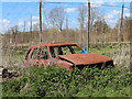 TQ6443 : Burnt out car and hop field at Reeds Farm by Oast House Archive