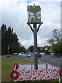 The village sign at Newington