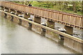 View of the breakwater and path from the bridge on Mill Road