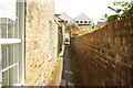 View along an alleyway between houses on The Folly