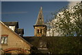 View of a church spire in the River Meads complex from the train near St. Margaret