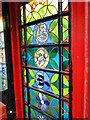 Glass art in a disused telephone box