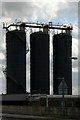 SJ7897 : Three black silos by Alan Murray-Rust