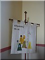 NY3250 : St Andrew, Thursby: banner by Basher Eyre