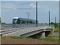 SK5635 : Training tram on Fairham Brook Bridge by Alan Murray-Rust