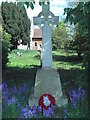 Southolt War Memorial beneath the churchyard trees