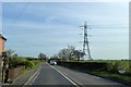 SJ4917 : Power cables crossing the A528 south of Broadoak by David Smith