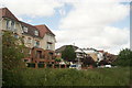 View of houses on Forest View from the path leading into the forest #4