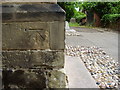 Nineteenth-century benchmark on Whetstone church