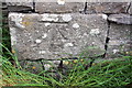 Benchmark on barn opposite Rowe Farm