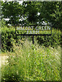 TM1381 : Walcot Green Farm sign by Geographer