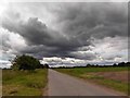 SK7597 : Dark clouds over Tindale Bank Road by Steve  Fareham