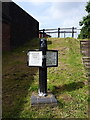 Canalside marker post at All Saints