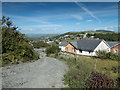 View east down farm track towards Parc Dinas