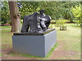 A Henry Moore reclining figure in the woodland garden at Hatfield House