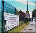 Banner on Lower Ormeau Road publicizing education provision through the medium of Irish