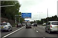 SJ9702 : Motorway direction signs over the M6 by Steve Daniels