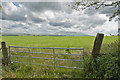 A gate at Rough Hill offering a view of Pendle Hill