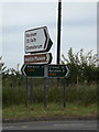 TG2115 : Roadsigns on the A140 Cromer Road by Geographer