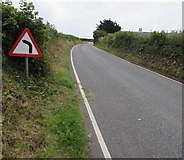 SS0198 : Bend in the road sign near Freshwater East  by Jaggery