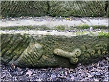 NY9170 : Carved stone at remains of Chesters Roman Bridge by Andrew Curtis