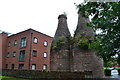 Preserved bottle kilns and modern apartments beside the Trent & Mersey Canal