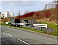 Black and white barrier at the edge of Heol Pendyrus, Penrhys